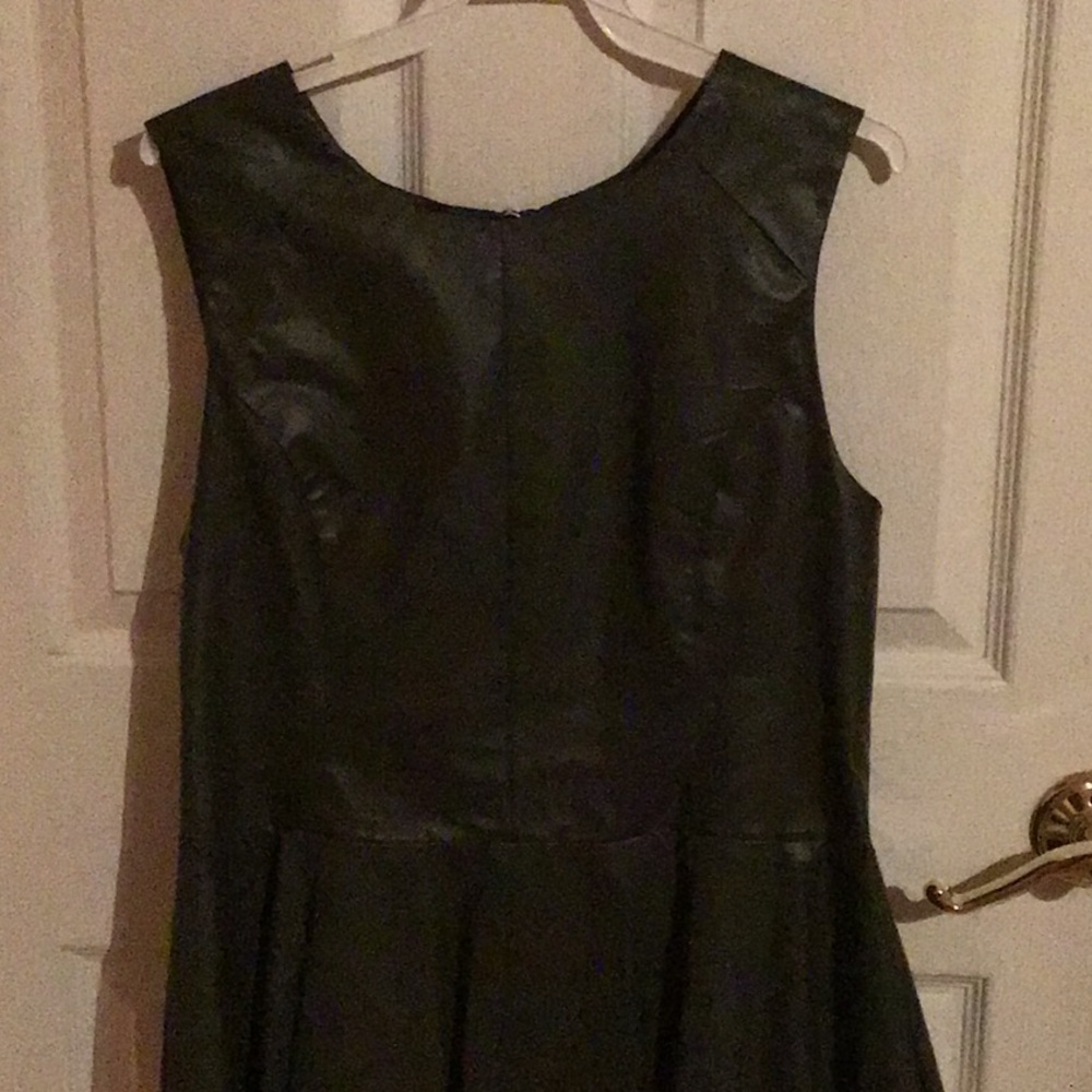 Olive green sleeveless peplum top